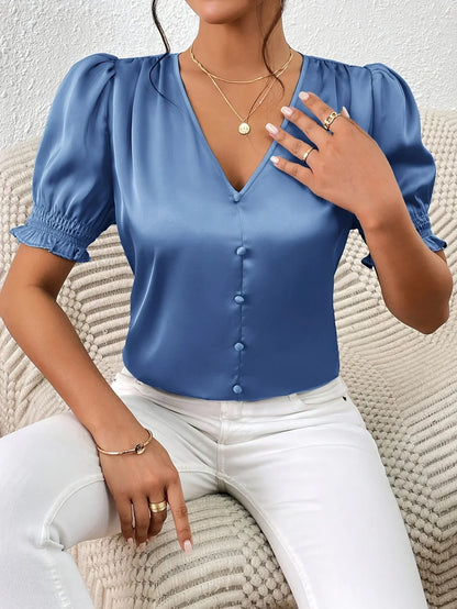Abella - Elegant bluse med V-hals og pufferm