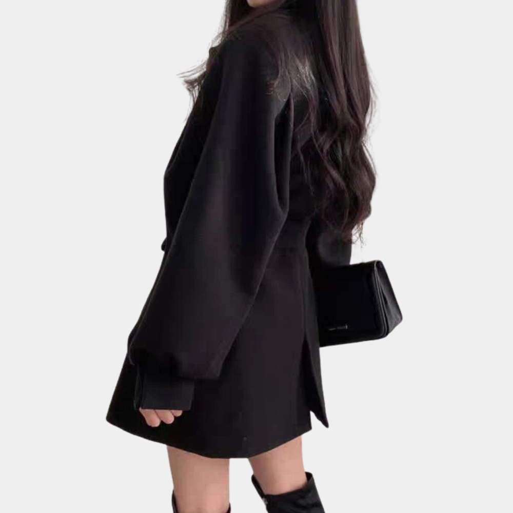 Elegant frakk for kvinner med puffermansjetter og belte